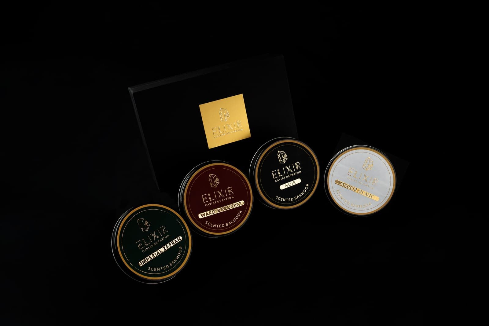 The four tins fanned on their boxes