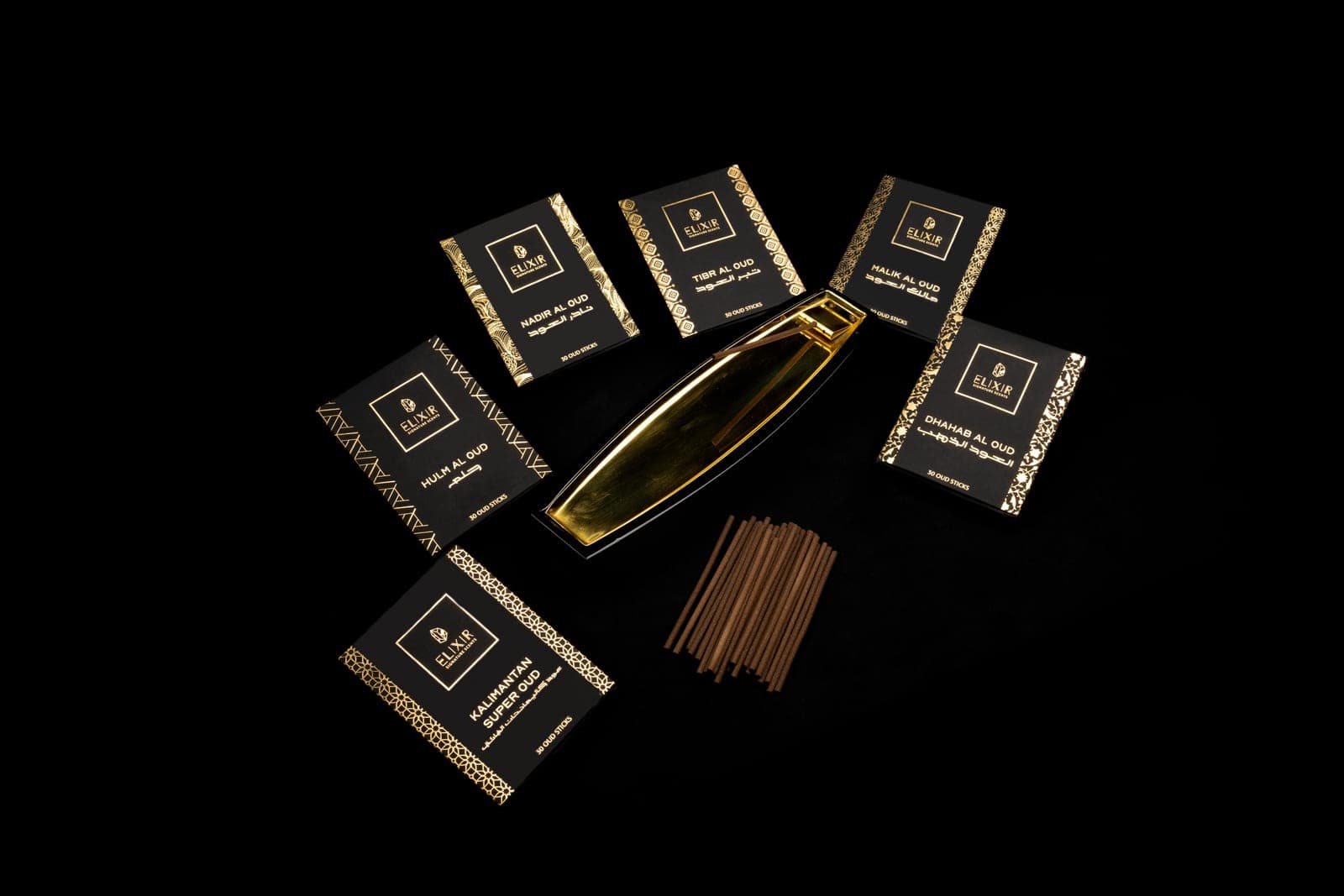 Oud incense boxes, sticks and the holder, laid out