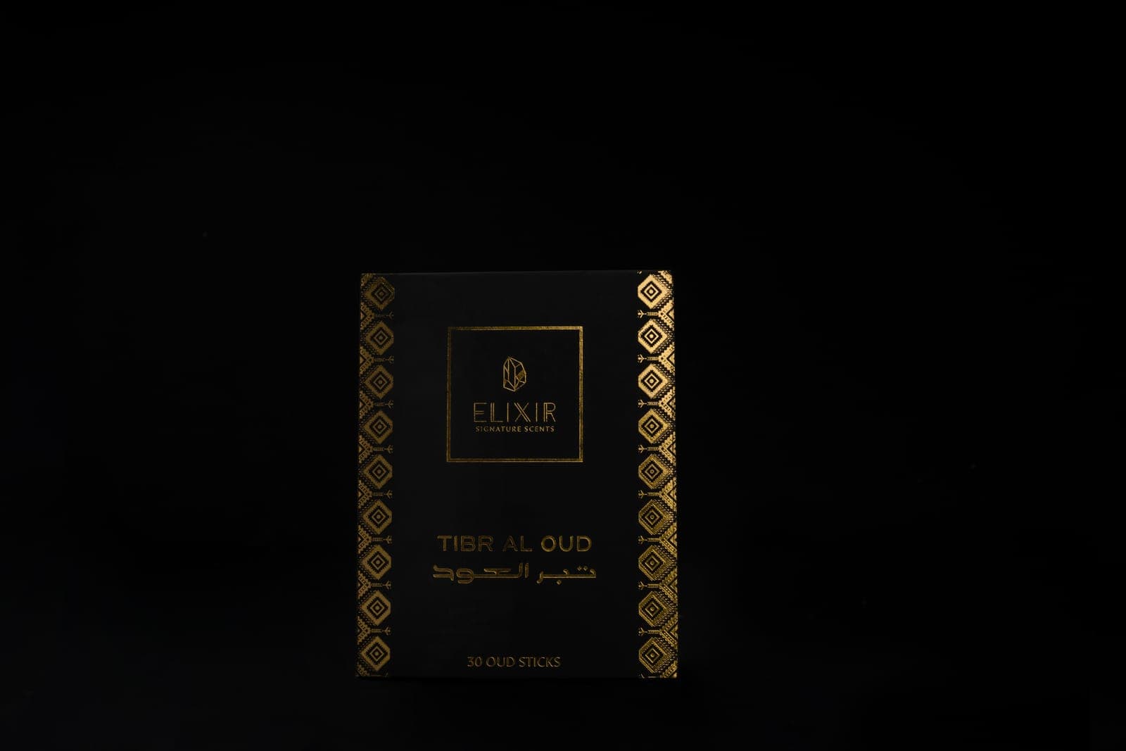 An Elixir oud pack in black and gold