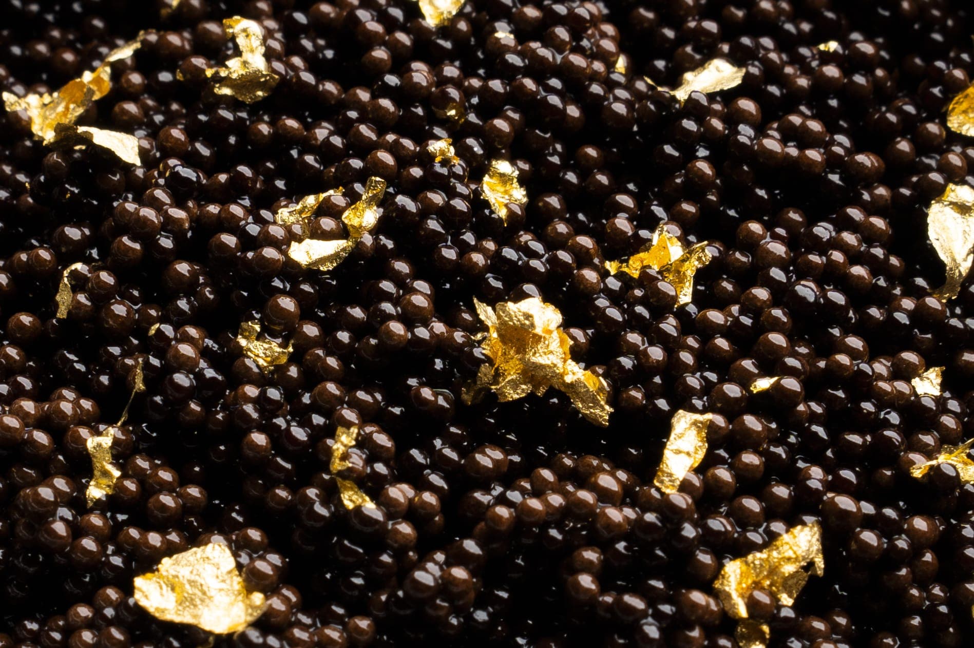Dark pearls with flakes of 24-karat gold