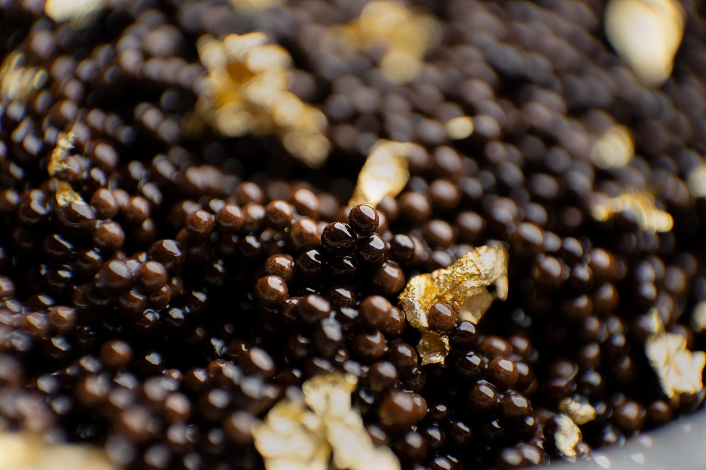 Caviar Bakhoor pearls, close, with flakes of gold