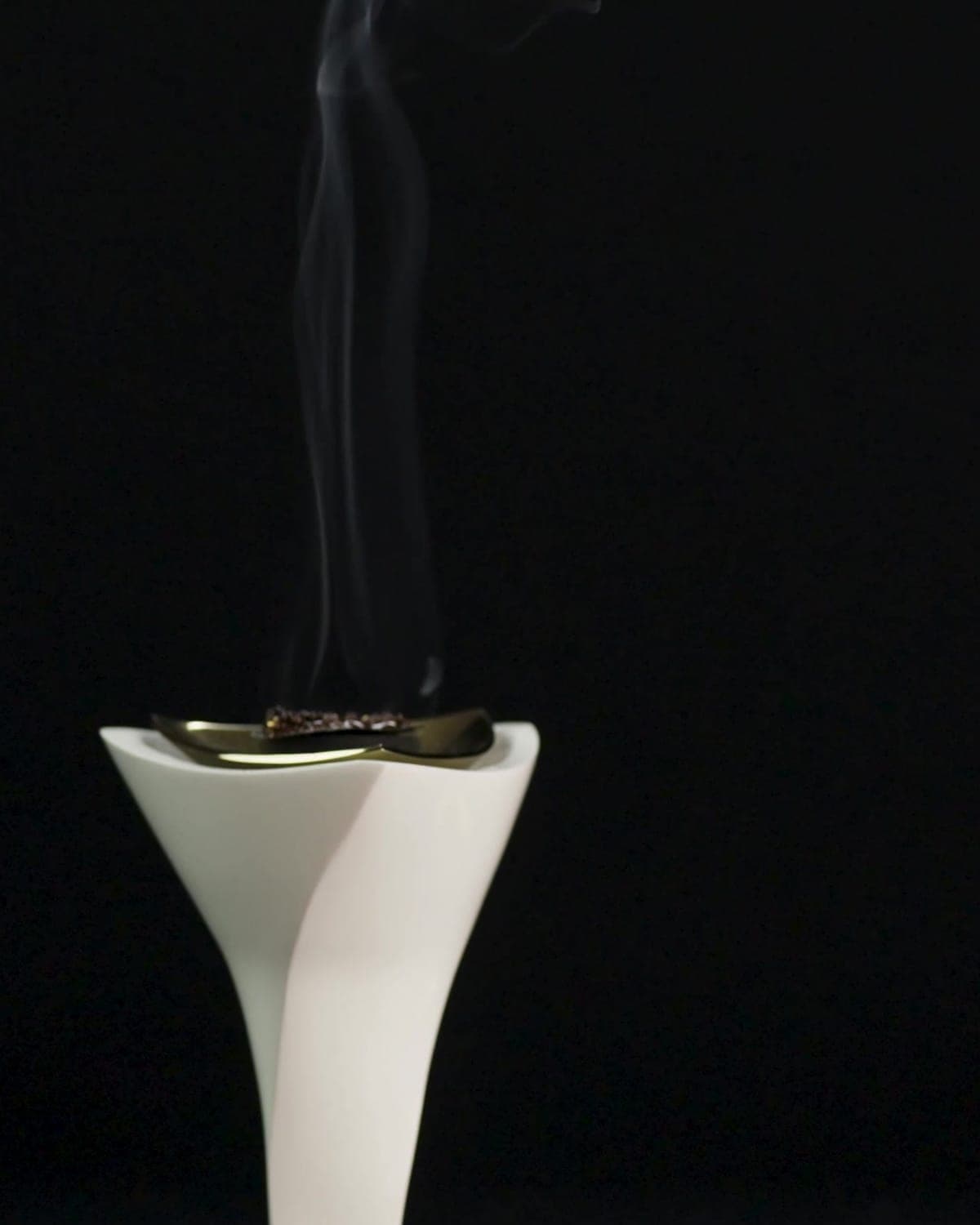 Smoke lifting from the burner as the pearls warm